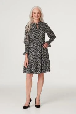 Printed Tie Neck Skater Dress 12 Printed Tie Neck Skater Dress -Hallmark Style D512875 MULTI BLACK 1